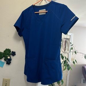 Women scrubs top size small, never worn